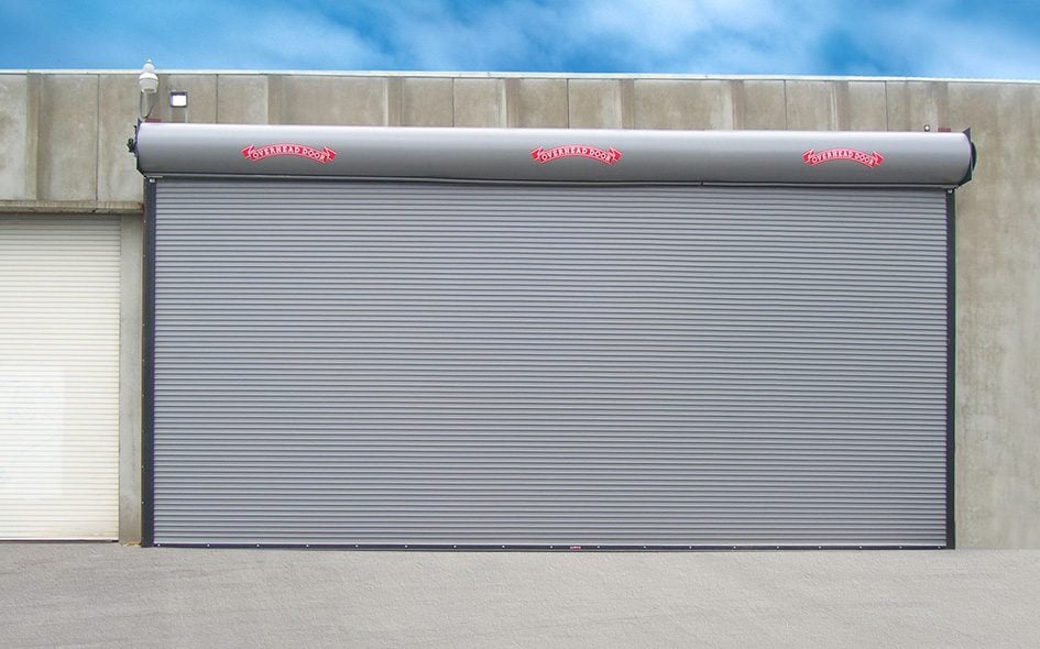 A large roller door featuring a prominent red stripe across its surface.